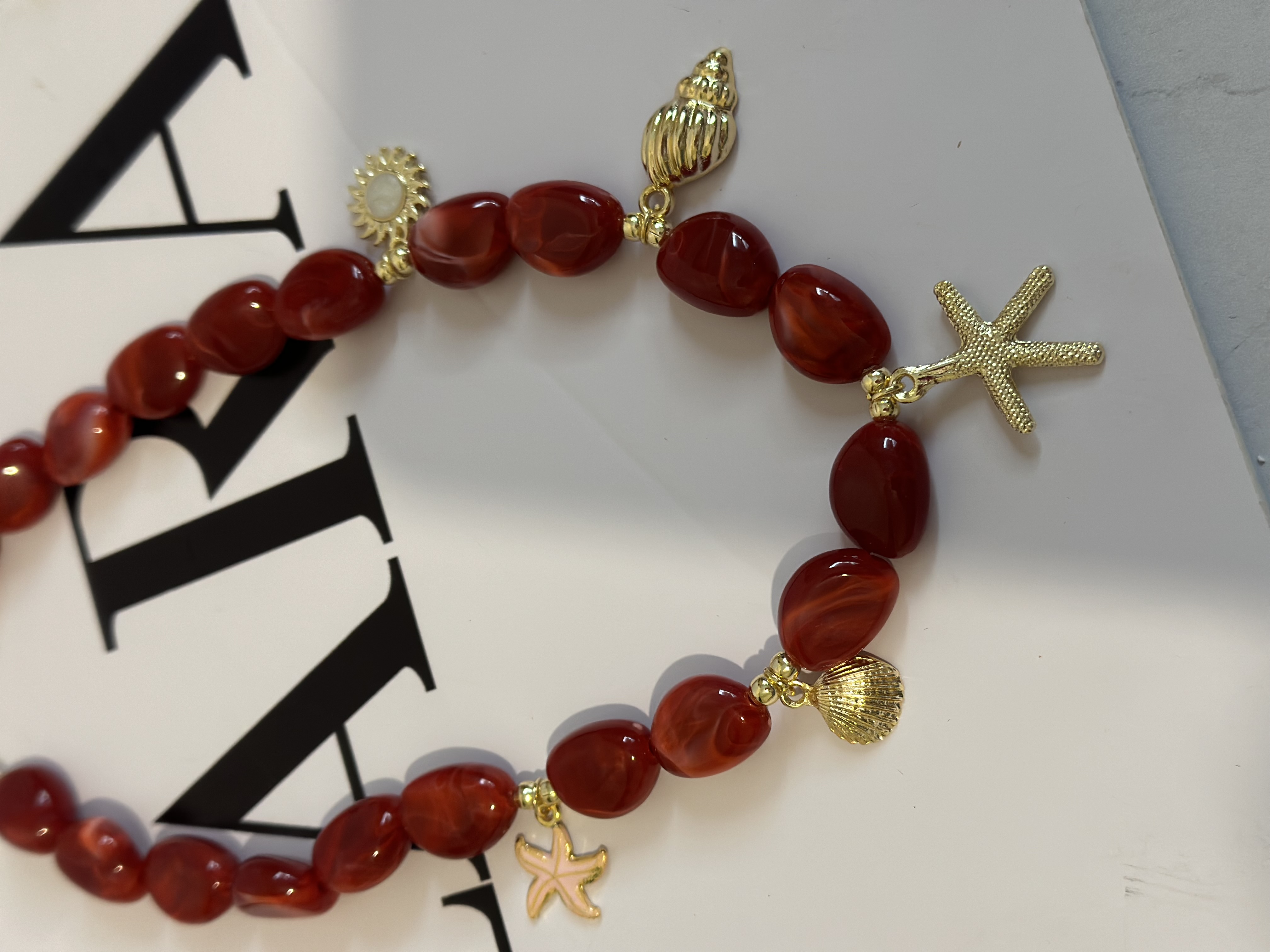 گردنبند زنانه سنگی آویز دار(چارم دار)ستاره و صدف